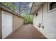 Outdoor deck space with wood plank flooring, neutral siding, and some outdoor furniture at 2239 Wensley Dr, Charlotte, NC 28210