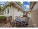 Exterior wooden deck with an outdoor table and chairs at 2239 Wensley Dr, Charlotte, NC 28210