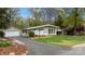 Charming single-story home featuring a detached garage and well-manicured lawn at 2239 Wensley Dr, Charlotte, NC 28210