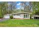 Beautiful ranch-style home with an attached garage, manicured lawn, and plenty of curb appeal at 2239 Wensley Dr, Charlotte, NC 28210