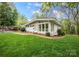 Charming single-story home with well-maintained lawn and mature trees in a desirable neighborhood at 2239 Wensley Dr, Charlotte, NC 28210
