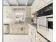 Bright kitchen with white cabinets, stainless steel dishwasher, and a double oven at 2239 Wensley Dr, Charlotte, NC 28210