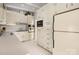 Charming kitchen with white cabinets, classic appliances, and ample storage space at 2239 Wensley Dr, Charlotte, NC 28210