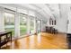 Spacious living area features hardwood flooring, a vaulted ceiling, and lots of natural light at 2239 Wensley Dr, Charlotte, NC 28210