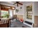 Cozy sunroom with comfortable seating, a ceiling fan, and plenty of natural light at 2239 Wensley Dr, Charlotte, NC 28210