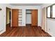 Bedroom featuring hardwood floors, closet and built in shelving at 225 Enwood Dr, Charlotte, NC 28214