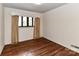 Cozy bedroom featuring hardwood floors and natural light at 225 Enwood Dr, Charlotte, NC 28214