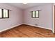 Bedroom featuring hardwood floors and natural light at 225 Enwood Dr, Charlotte, NC 28214