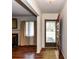 Inviting entryway featuring hardwood floors and view of a living room with fireplace at 225 Enwood Dr, Charlotte, NC 28214