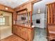 View of the kitchen shows ample cabinetry, tile floors, and a breakfast bar at 225 Enwood Dr, Charlotte, NC 28214