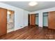 Bedroom featuring hardwood floors, closet and ensuite bathroom at 225 Enwood Dr, Charlotte, NC 28214