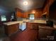 Traditional kitchen featuring wooden cabinets, white tile countertops, and vintage appliances at 229 N Jones Ave, Rock Hill, SC 29730
