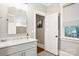 Bathroom featuring a sink with a white countertop and a view through the window at 2315 Dundeen St, Charlotte, NC 28216