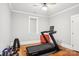 Bedroom with wood floors and a treadmill with various workout equipment at 2315 Dundeen St, Charlotte, NC 28216