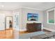 Bedroom featuring hardwood floors, an adjacent closet and modern decor at 2315 Dundeen St, Charlotte, NC 28216