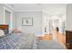 Bedroom featuring hardwood floors and modern decor with an adjacent sitting area at 2315 Dundeen St, Charlotte, NC 28216
