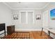 Bedroom with hardwood floors and a bed frame with a view of a window and dresser at 2315 Dundeen St, Charlotte, NC 28216