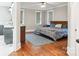Bright bedroom with hardwood floors, natural light, and a walk-in bathroom at 2315 Dundeen St, Charlotte, NC 28216