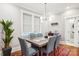 Dining room with table, chairs, decor, hardwood floor and a modern light fixture at 2315 Dundeen St, Charlotte, NC 28216