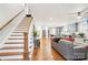 Spacious living area with hardwood floors and staircase at 2315 Dundeen St, Charlotte, NC 28216