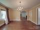 Charming dining room with hardwood floors, vintage chandelier, and an open layout at 2326 Armstrong Cir, Gastonia, NC 28054