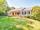 Attractive single-Gathering home with a well-manicured lawn, lush landscaping, and inviting porch at 2326 Armstrong Cir, Gastonia, NC 28054