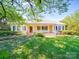 Charming home with a well-maintained lawn, inviting front porch, and classic curb appeal at 2326 Armstrong Cir, Gastonia, NC 28054