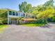 Two-story home with a lush garden, driveway and covered entrance at 2326 Armstrong Cir, Gastonia, NC 28054