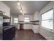 Bright kitchen featuring white cabinetry, stainless steel appliances, and ample counter space at 2326 Armstrong Cir, Gastonia, NC 28054
