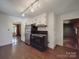 A vintage kitchen showcases wood floors, stainless steel refrigerator and black appliances at 2326 Armstrong Cir, Gastonia, NC 28054