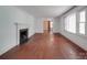 Bright living room with fireplace and hardwood floors, offering a cozy and inviting atmosphere at 2326 Armstrong Cir, Gastonia, NC 28054