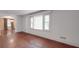 Spacious living room featuring hardwood floors, natural light, and an open archway at 2326 Armstrong Cir, Gastonia, NC 28054