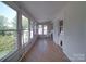 Bright sunroom with a wall of windows, offering scenic views and natural light at 2326 Armstrong Cir, Gastonia, NC 28054