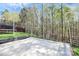 Flat backyard space features a court area, perfect for recreation and outdoor activities with privacy fence at 2425 Orofino Ct, Charlotte, NC 28269