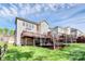 Expansive backyard features a deck, a basketball court and lots of green space for outdoor enjoyment at 2425 Orofino Ct, Charlotte, NC 28269