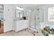 This bright bathroom features a walk-in shower and separate tub, creating a functional and stylish space at 2425 Orofino Ct, Charlotte, NC 28269