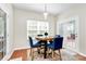 Charming breakfast nook with a round table, blue chairs, and access to the outdoor deck at 2425 Orofino Ct, Charlotte, NC 28269