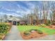 Golf shop exterior with inviting entrance and well-maintained landscaping, creating a welcoming atmosphere at 2425 Orofino Ct, Charlotte, NC 28269