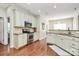 This kitchen features granite countertops, hardwood floors and modern appliances creating a stylish and functional space at 2425 Orofino Ct, Charlotte, NC 28269