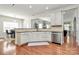 Bright kitchen with granite countertops, stainless dishwasher, and hardwood flooring is perfect for cooking and entertaining at 2425 Orofino Ct, Charlotte, NC 28269