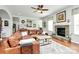 Cozy living room with hardwood floors, a fireplace, and comfortable seating at 2425 Orofino Ct, Charlotte, NC 28269