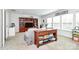 Spacious living room featuring a large bookcase and table filled with games at 2425 Orofino Ct, Charlotte, NC 28269