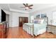 Spacious main bedroom with tray ceiling, wood floors, and large windows at 2425 Orofino Ct, Charlotte, NC 28269