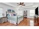 Spacious main bedroom with tray ceiling, wood floors, and natural light at 2425 Orofino Ct, Charlotte, NC 28269