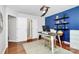 Bright office with hardwood floors, a constellation-themed accent wall, and a modern desk setup at 2425 Orofino Ct, Charlotte, NC 28269