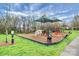 Community playground area featuring slides, climbing structures and swings, perfect for children to play and enjoy at 2425 Orofino Ct, Charlotte, NC 28269