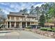 Upscale clubhouse boasts a pool area surrounded by lush landscaping and offers a luxurious recreational space at 2425 Orofino Ct, Charlotte, NC 28269