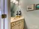 Bathroom with natural light, framed art and neutral vanity at 2516 Middlebridge Ln, Charlotte, NC 28270