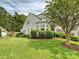 Well-manicured lawn and lush landscaping surround this lovely home, offering great curb appeal at 2516 Middlebridge Ln, Charlotte, NC 28270