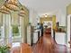 Well-lit kitchen with hardwood floors, white cabinets, granite countertops and stainless steel appliances at 2516 Middlebridge Ln, Charlotte, NC 28270